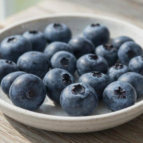 Fresh blueberries in a glass — are blueberries low FODMAP for IBS