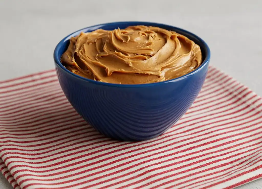 is peanut butter low FODMAP finished low FODMAP Thai peanut quinoa bowl served with edamame carrots red cabbage and peanut sauce