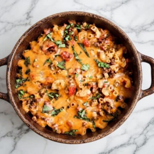 A hearty bowl of low FODMAP ground beef and potato stew served on a wooden table — low FODMAP ground beef recipes