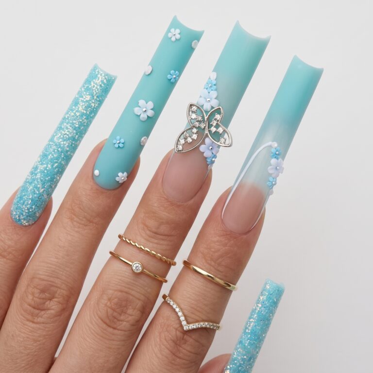Acrylic press on nails with a glossy nude base, soft white French tips, and delicate ring styling.