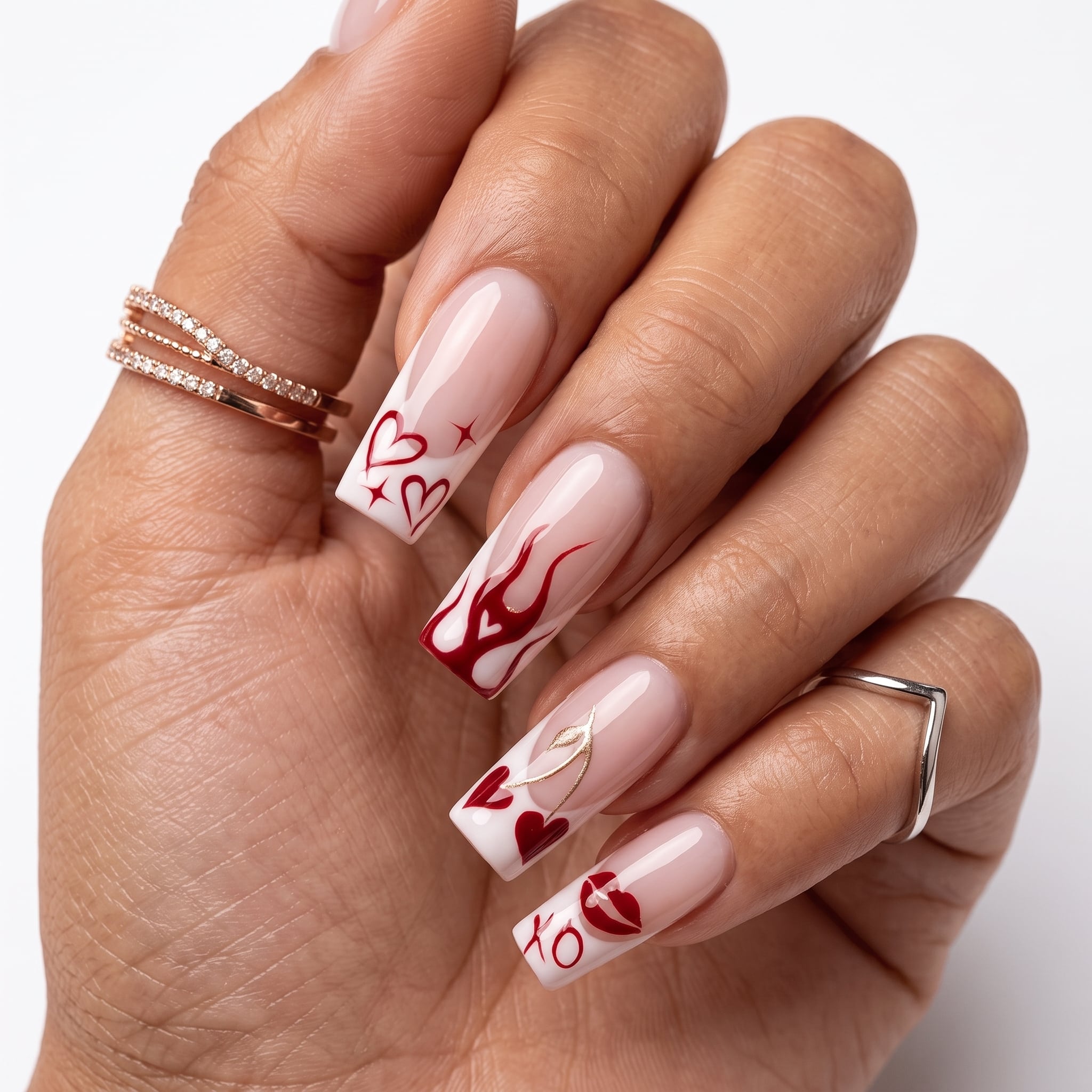 Pink floral acrylic press-ons with 3D flowers, rhinestone accents, and glossy sculpted tips.