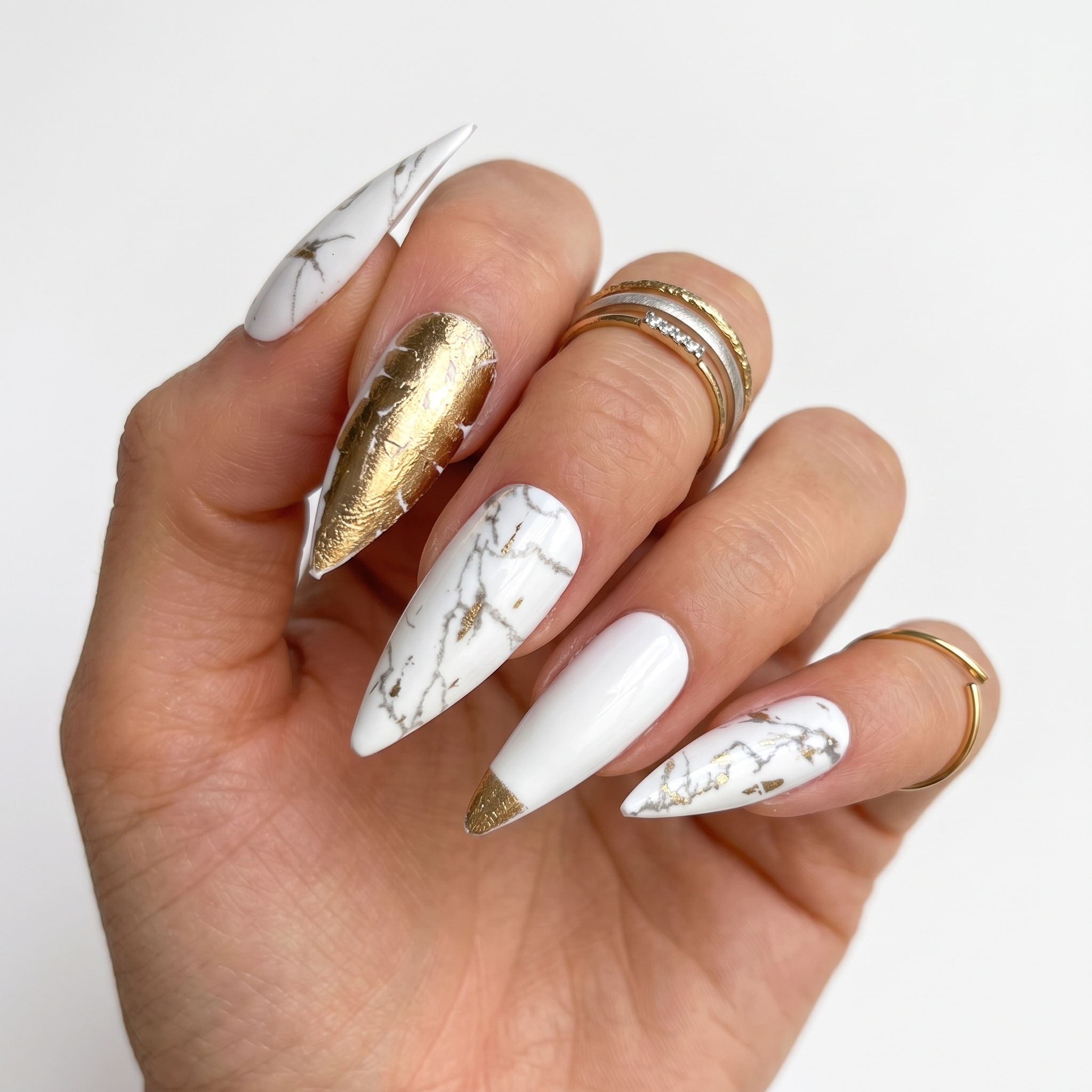 Classic nude acrylic press-ons with soft white tips, glossy finish, and blue sleeve styling.