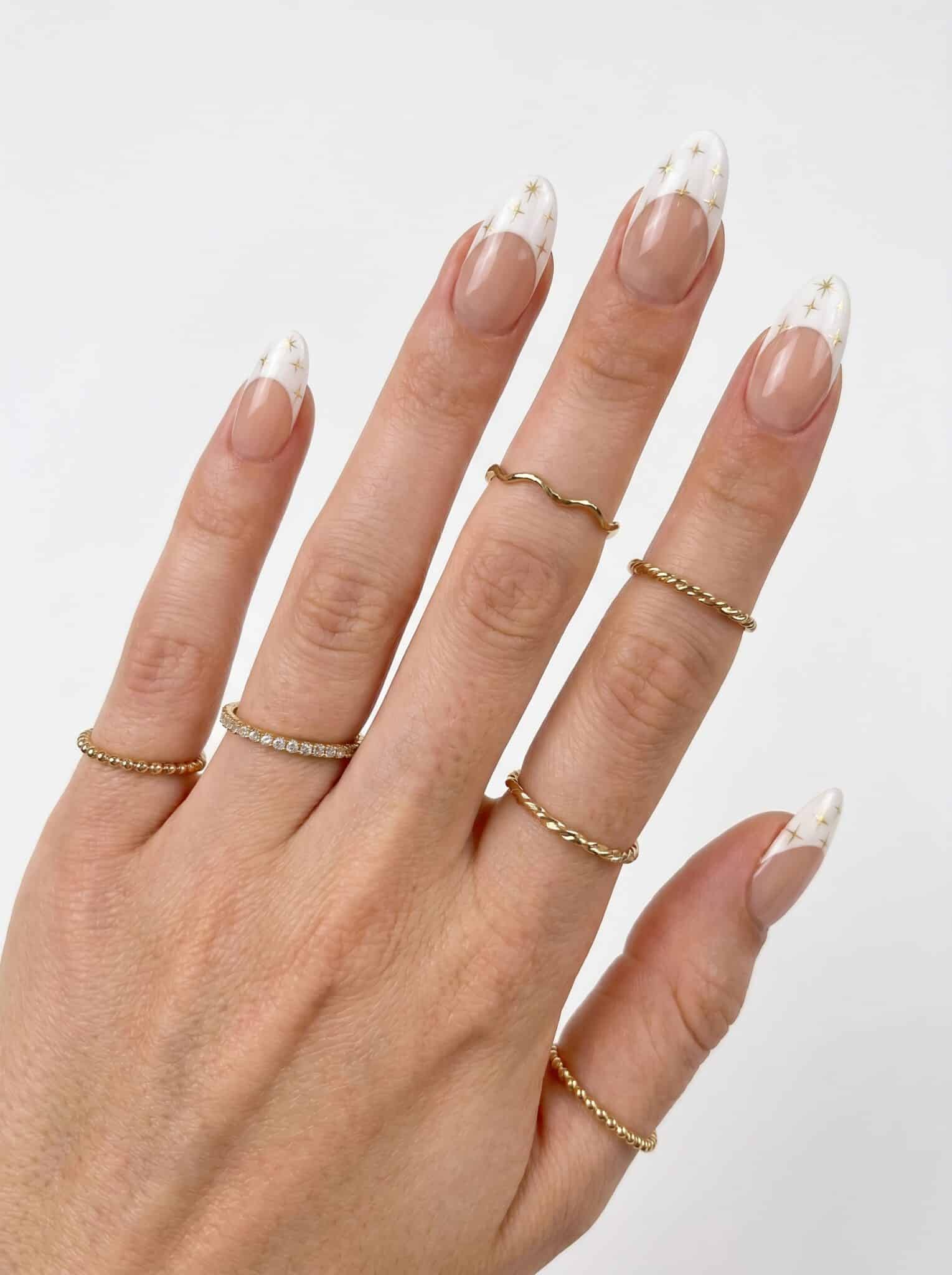 Best French Tip Press On Nails with glossy white tips on nude almond nails