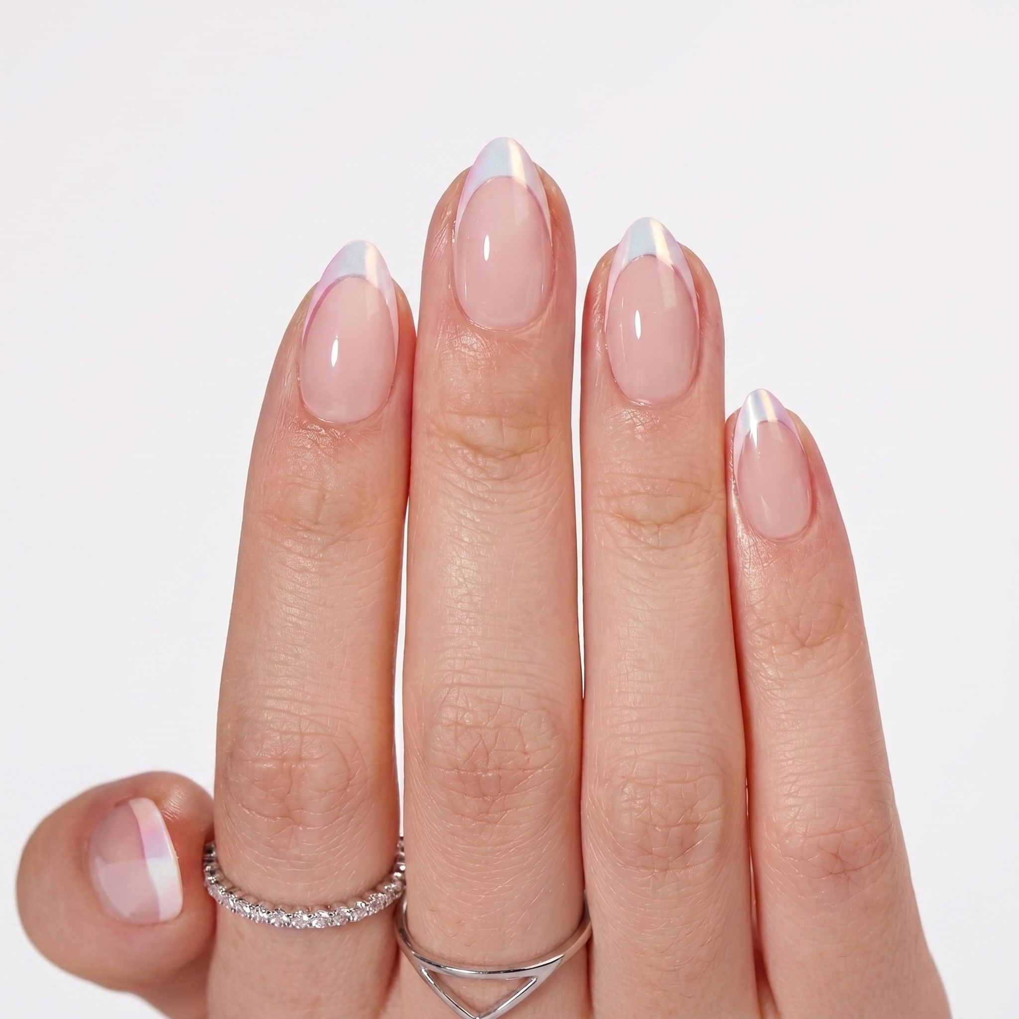 Long nude almond nails with crisp high-contrast white French tips