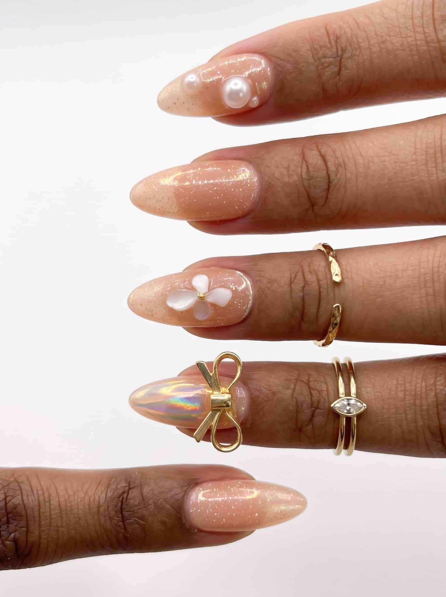 Short white nails with delicate blue floral accent art