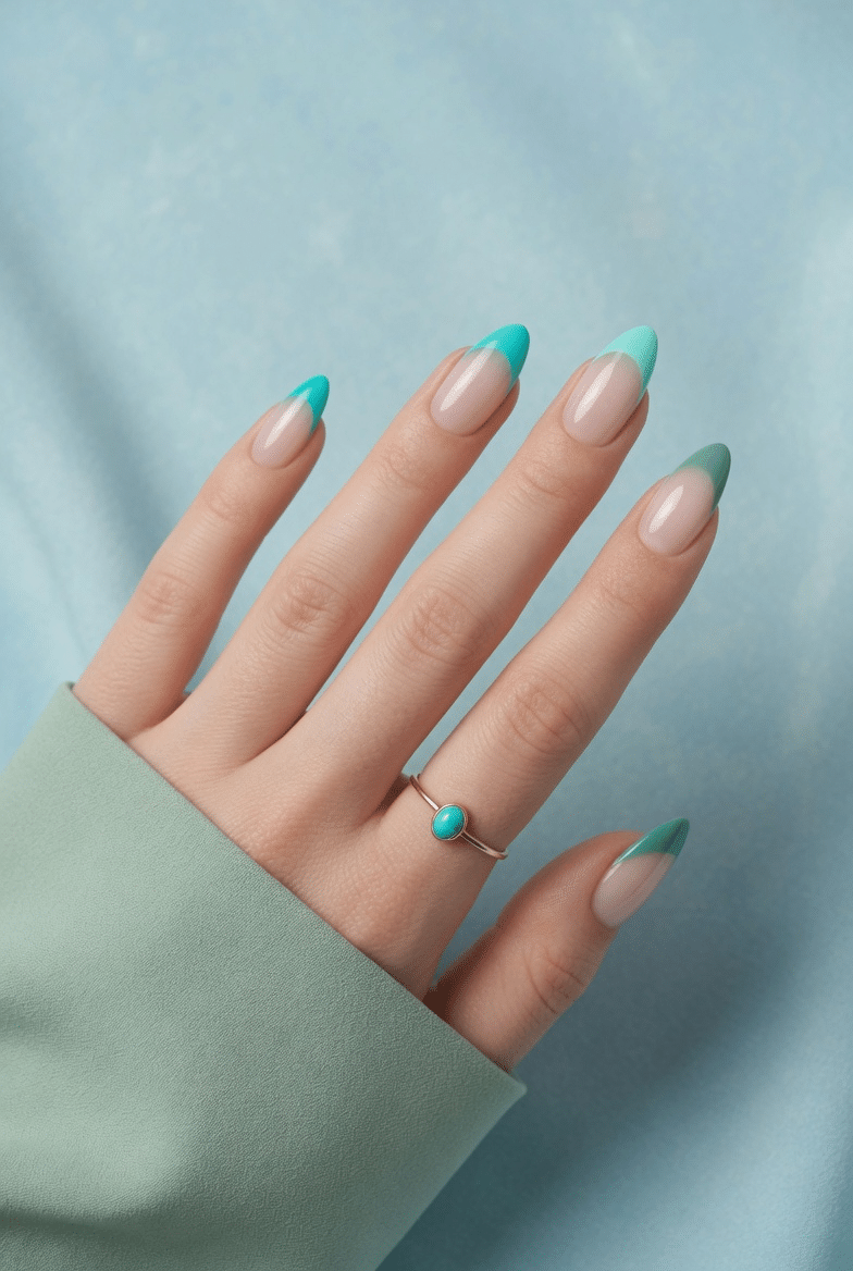 Blue and green colored French tip nails with glossy almond shape