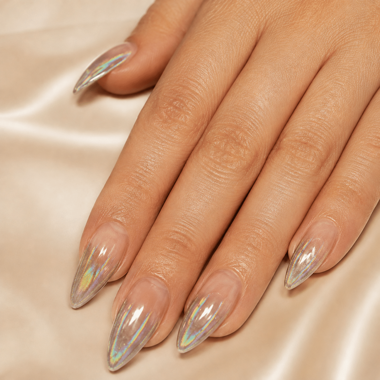 Chrome almond French nails with reflective shimmer tips.