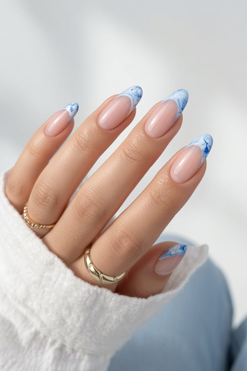Pastel French tip nails with yellow and blue summer accents