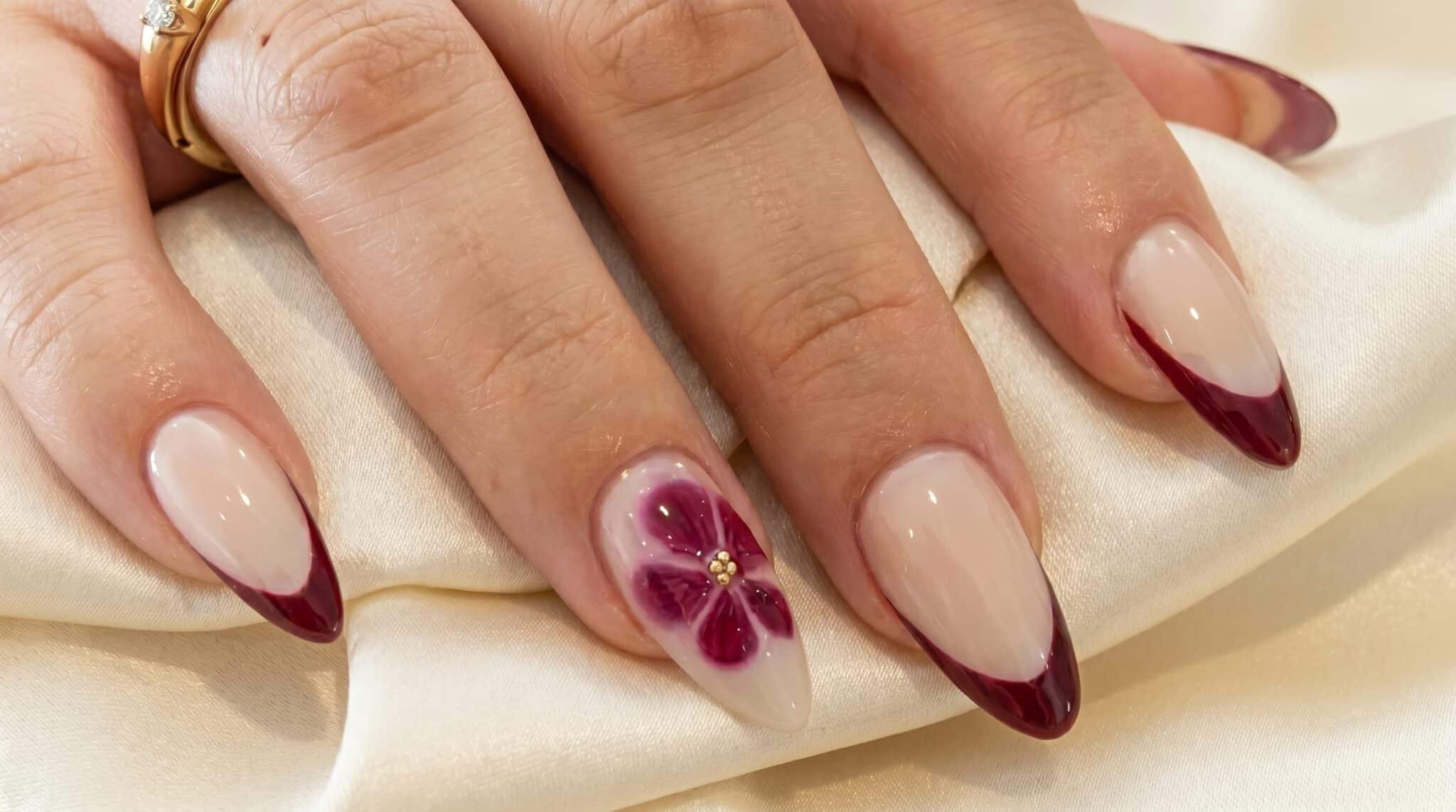 Yellow and blue summer French tips on glossy almond nails with a sheer nude base