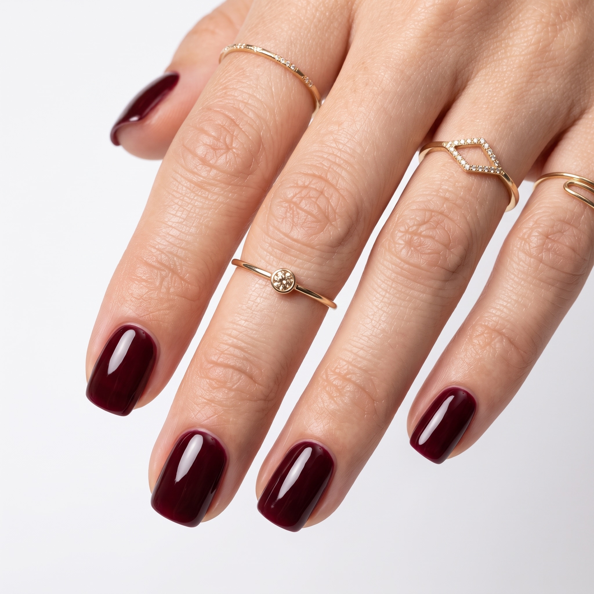 Navy blue extra short press-ons with a glossy finish and minimal rounded shape.