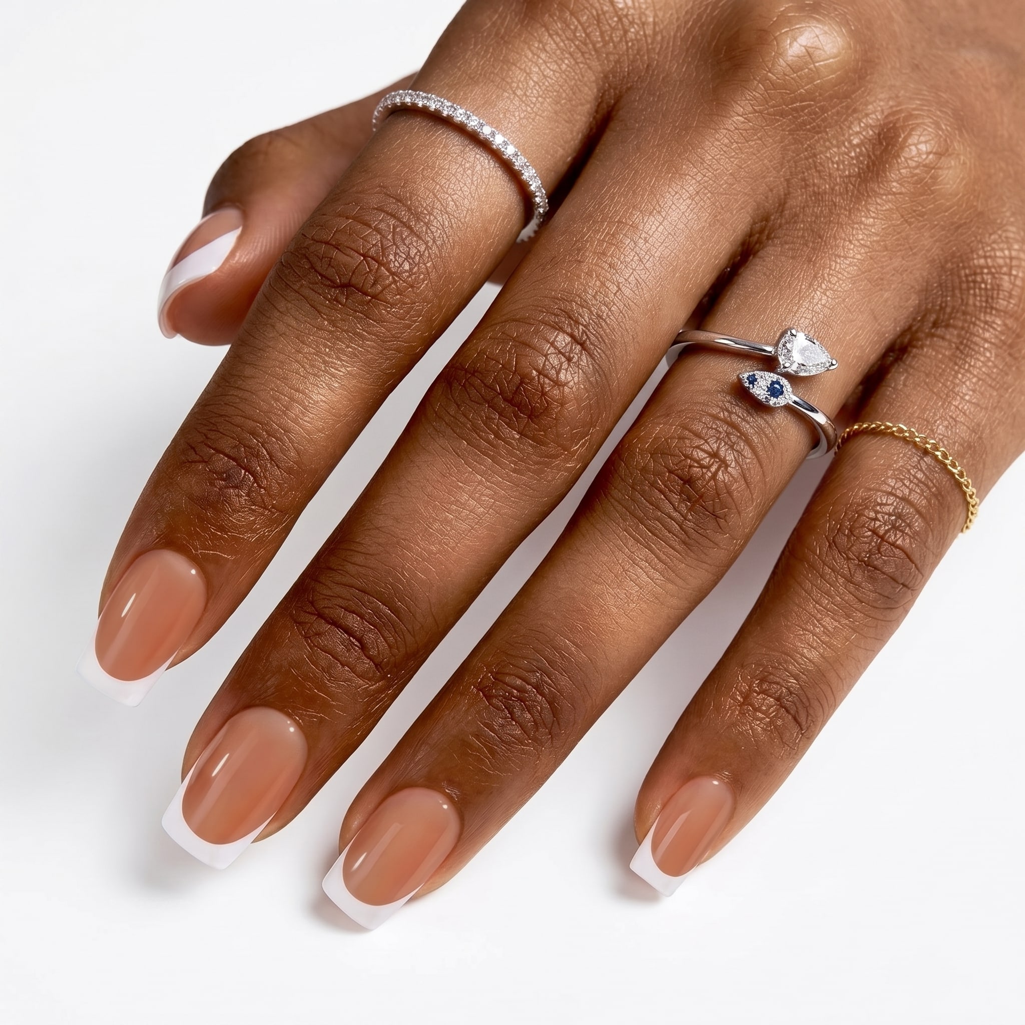 Blue extra short press-ons with floral accent nails and glossy pastel details.