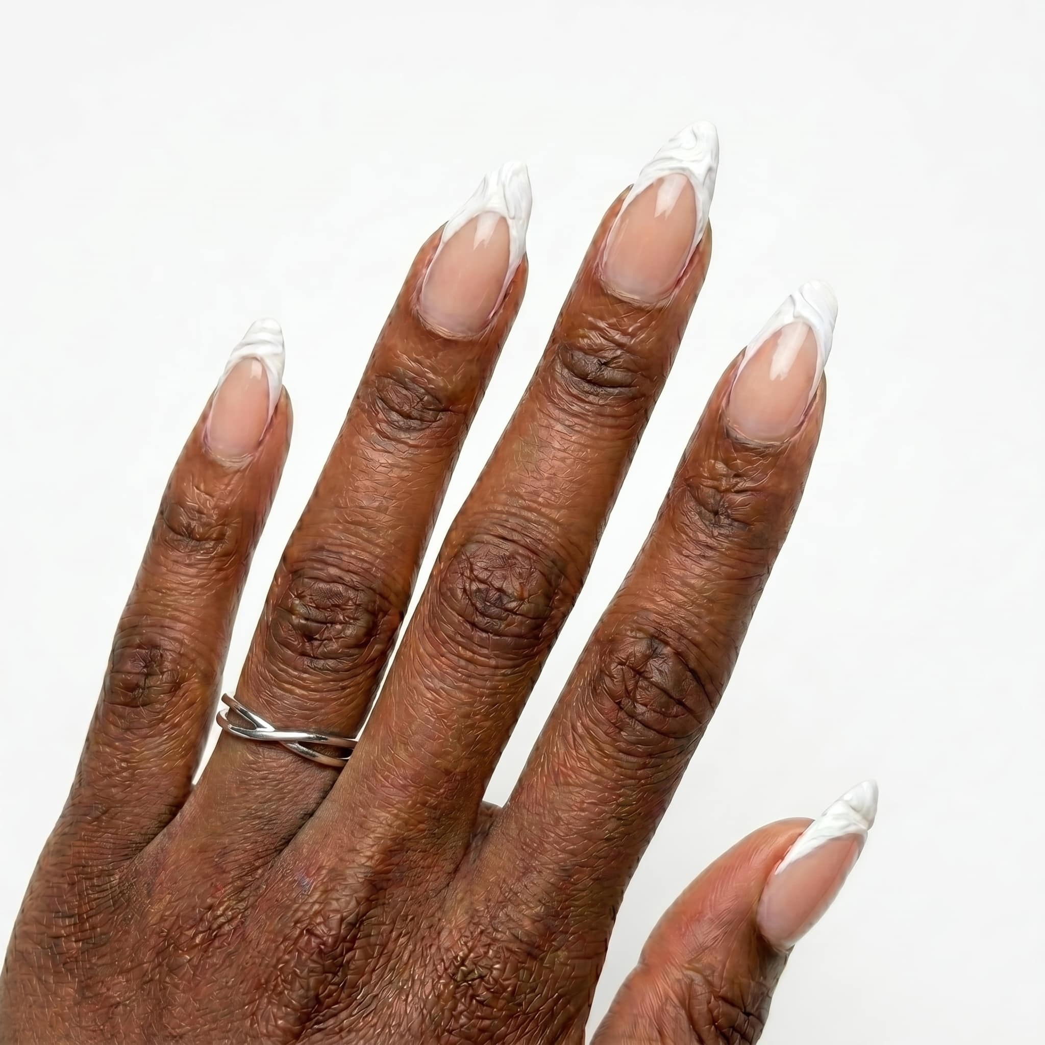 Ivory nude almond nails with slim white French tips