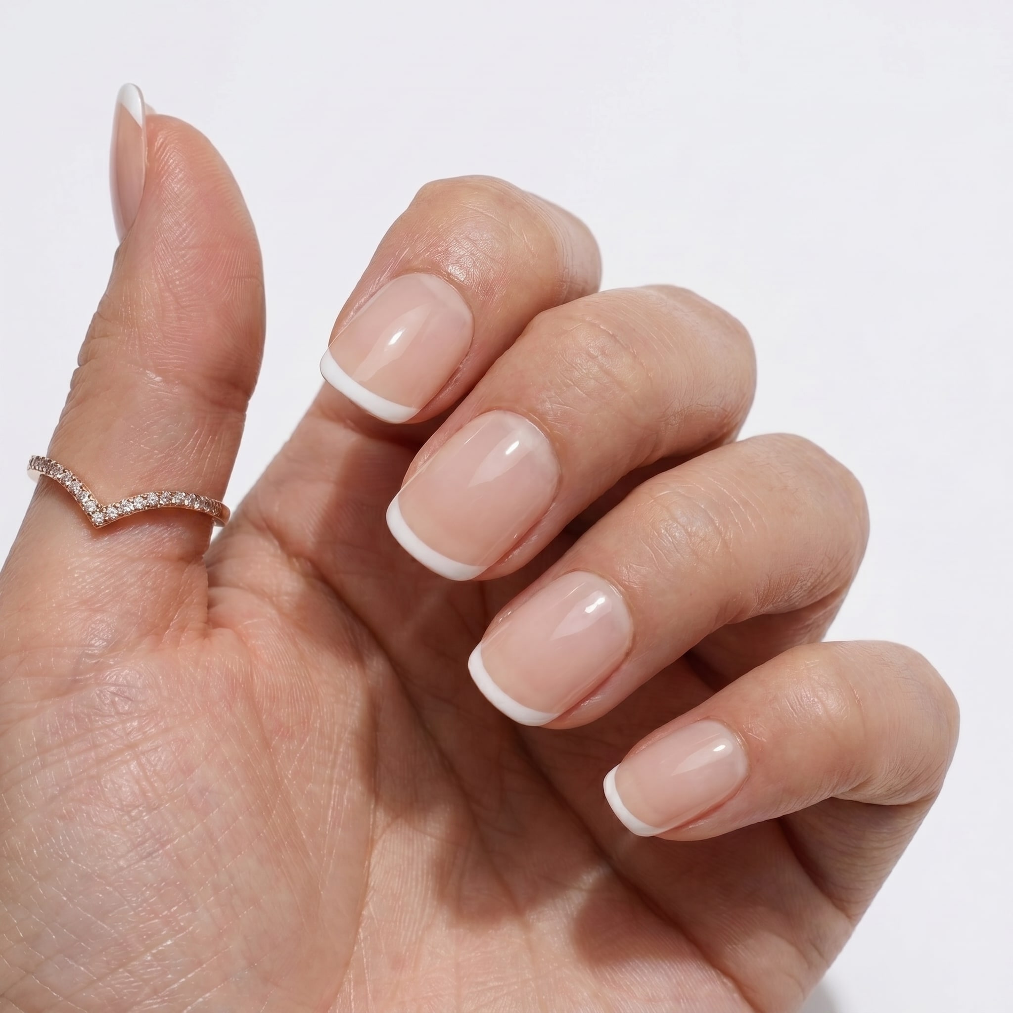 Pink nude almond nails with delicate white French tips