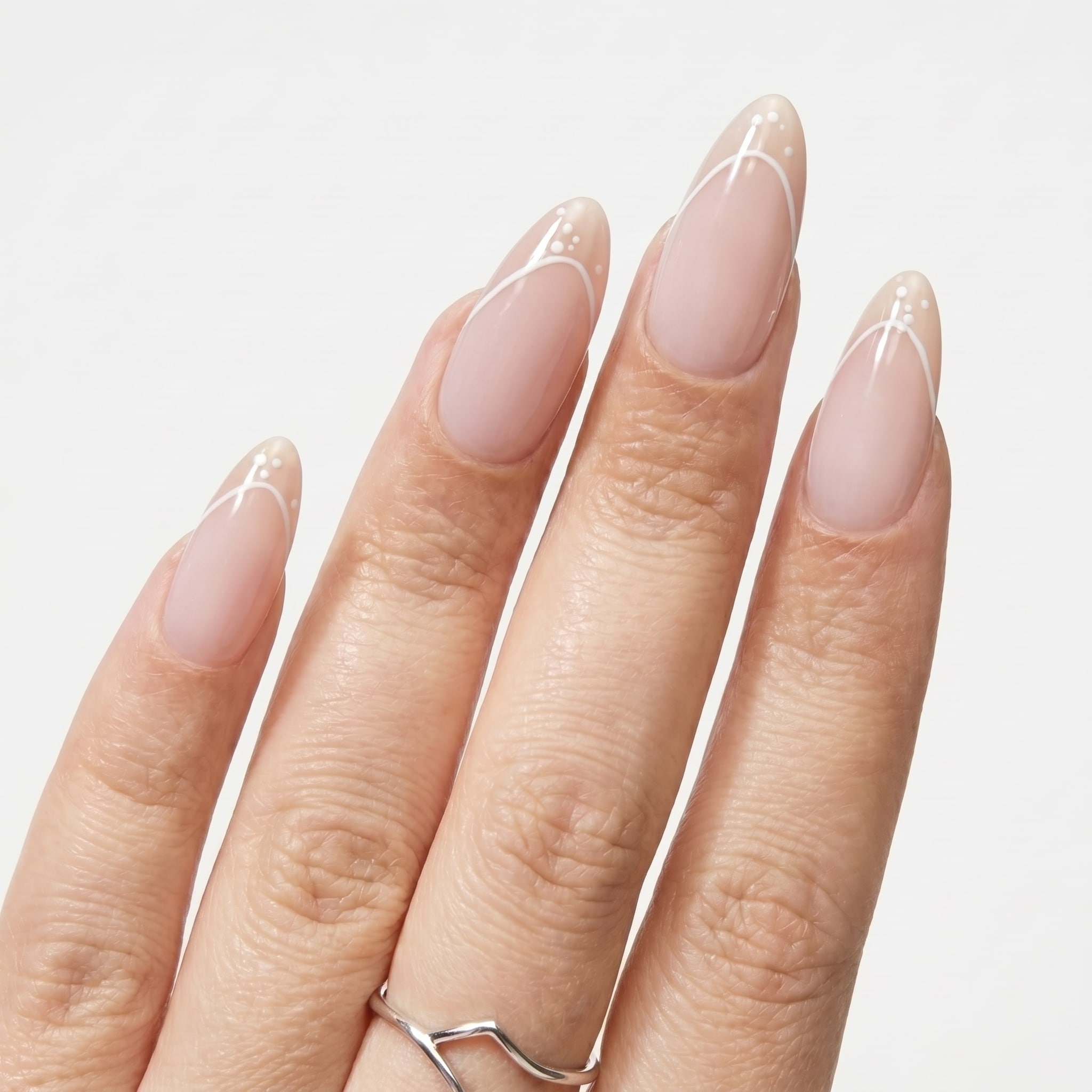 Short rounded nude nails with crisp white French tips