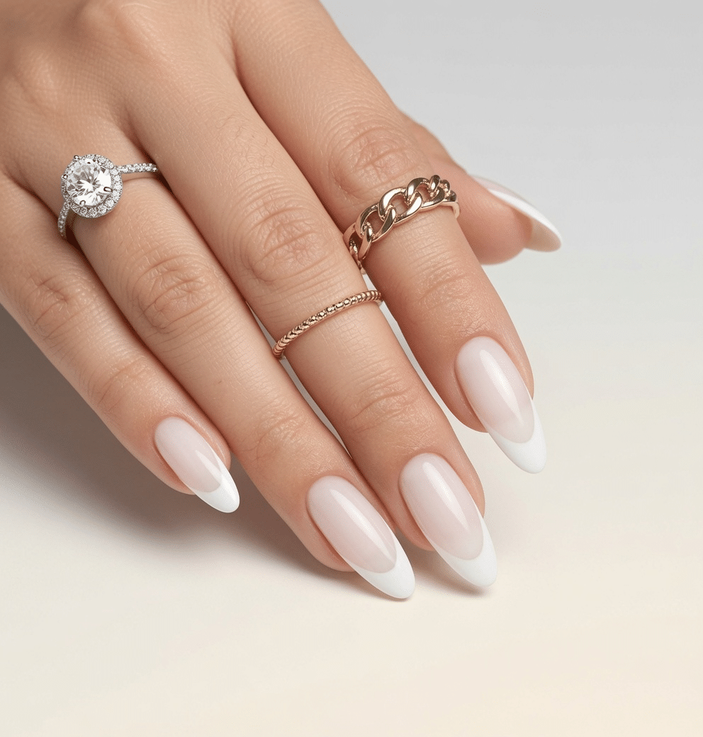 Milky white almond French tip nails with a soft creamy base and crisp white tips
