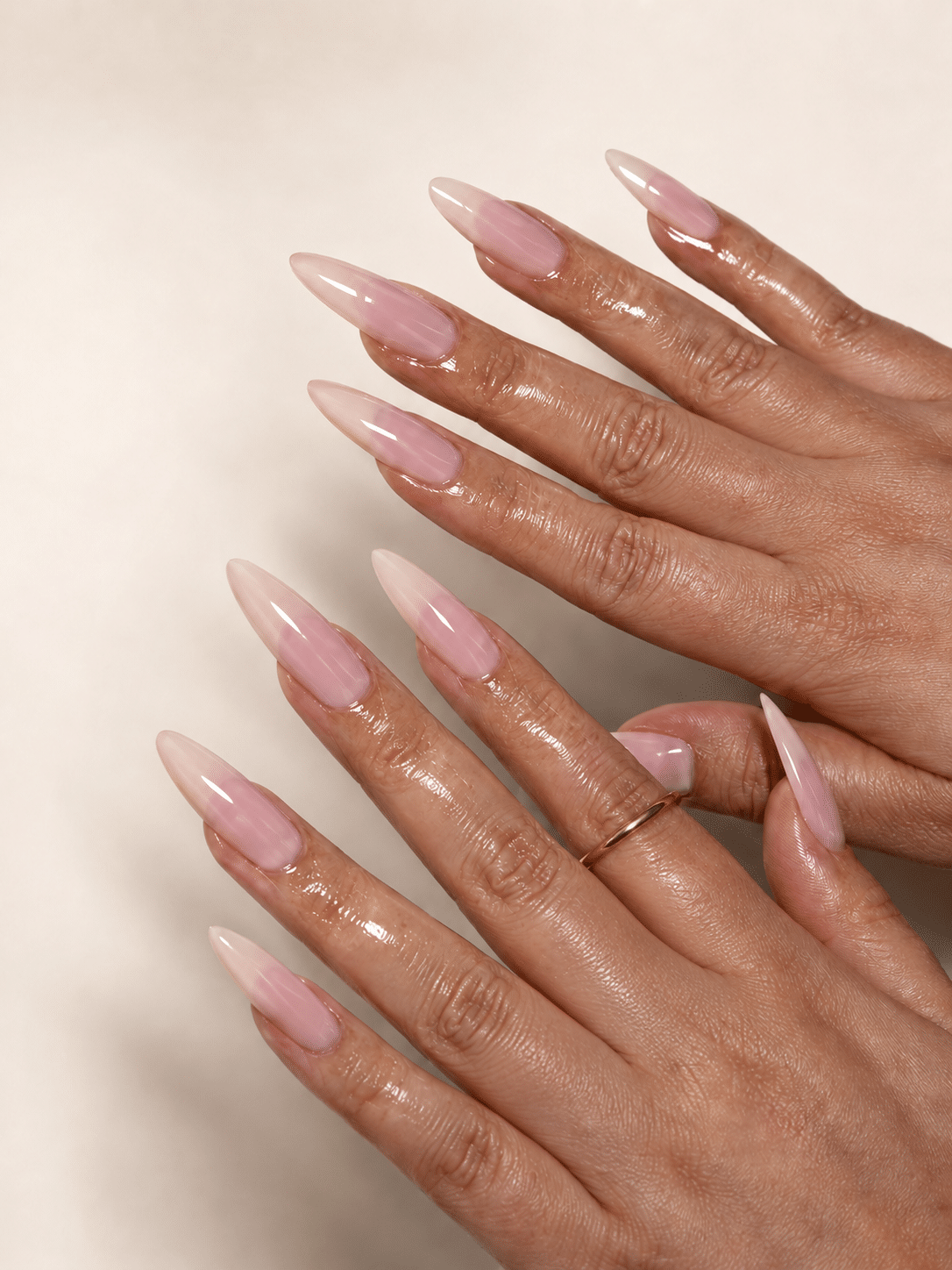 Milky white almond French tip nails with a feminine lifestyle finish