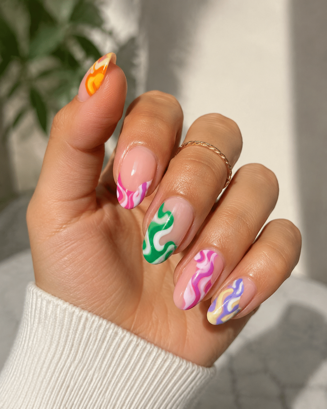Neon micro French tips on medium almond nails with a sheer base