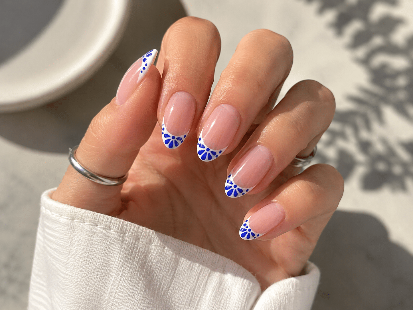 Ocean blue summer French nails with aqua tips and delicate accents