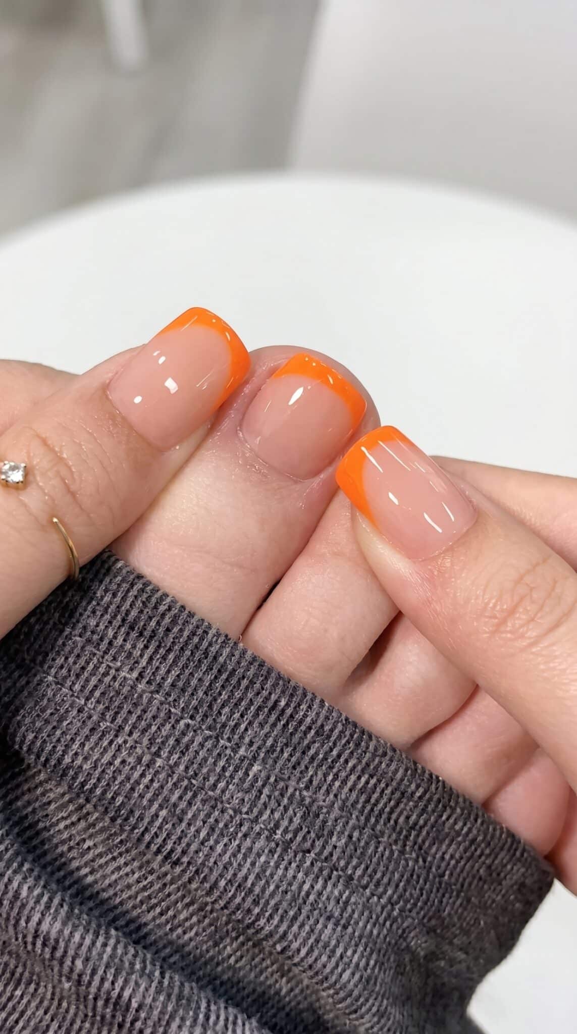 Short almond nails with soft pastel French tips for summer