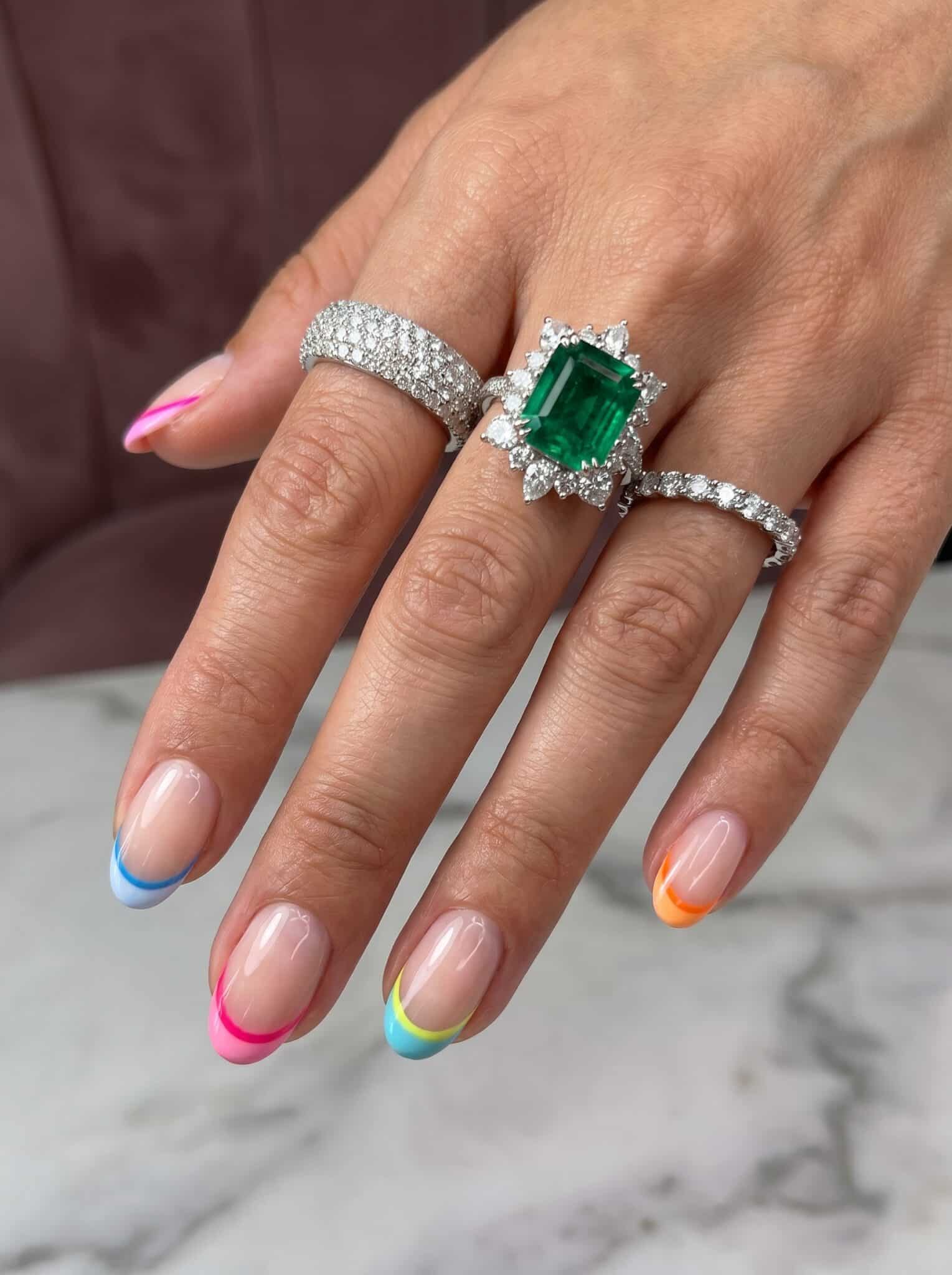 Simple short French tip nails with tiny summer flower accents