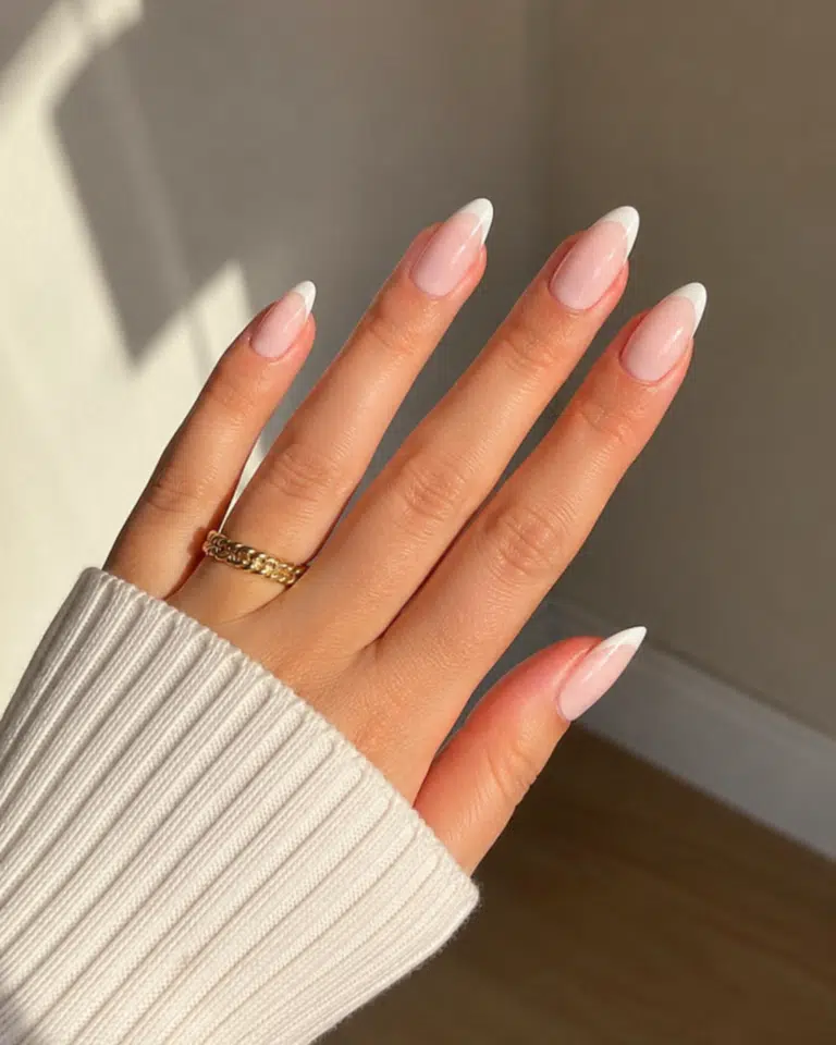 12 Summer French Nails 13 Summer French Tip Almond Nails with a milky nude base and thin glossy tips