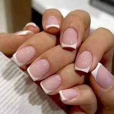 White French Tip Press On Nails with glossy white tips on nude almond nails