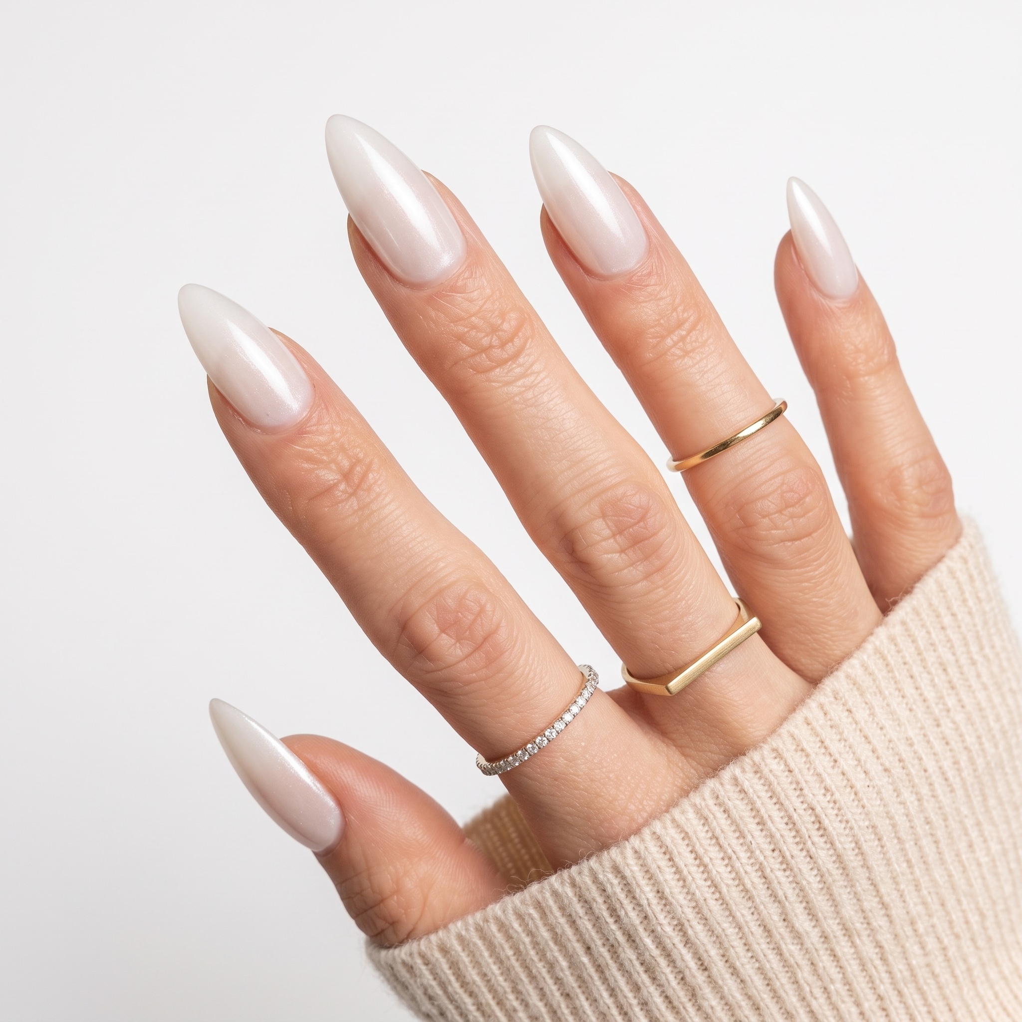 Soft glossy white square press-ons with a beige sleeve and natural hand pose.