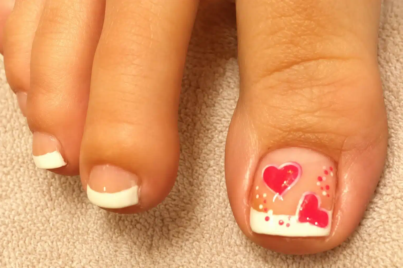 French Pedicure With Heart: 6 Romantic Toe Ideas 1 French pedicure with heart on the big toe