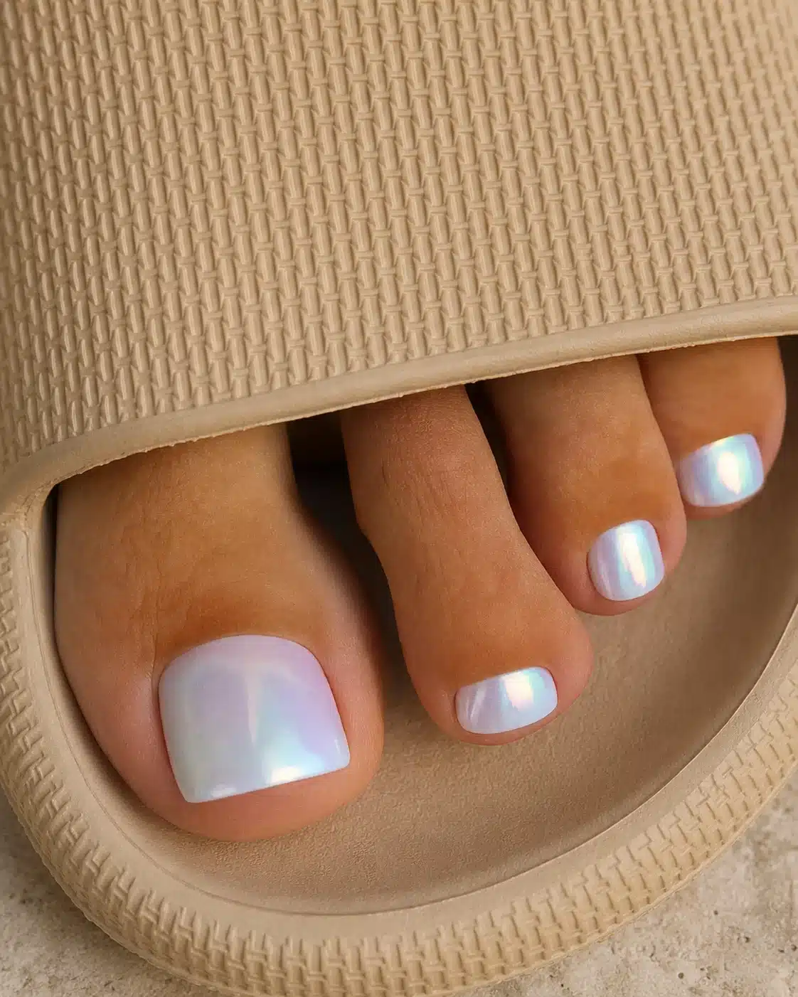 10 Milky White Chrome Pedicure Ideas You?ll See Everywhere in 2026 1 Milky white chrome pedicure with a pearly finish