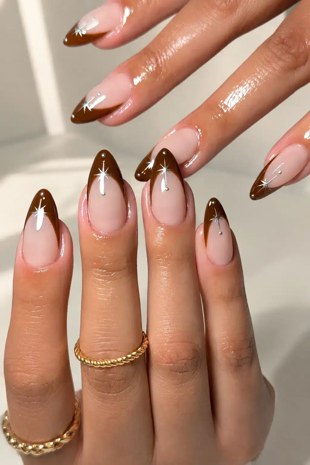 French Tip Nail Polish: Best Colors, Formulas & DIY Guide 9 Brown metallic French tip nail polish with a glossy finish