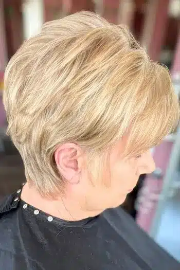 Honey Blonde Voluminous Polished Layered Pixie hairstyle