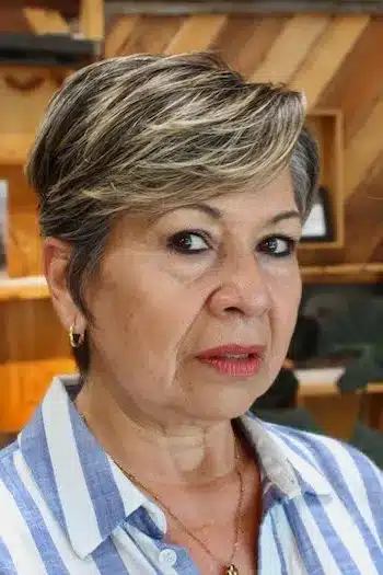 Highlighted Pixie With Side-Swept Bangs haircut for women over 60
