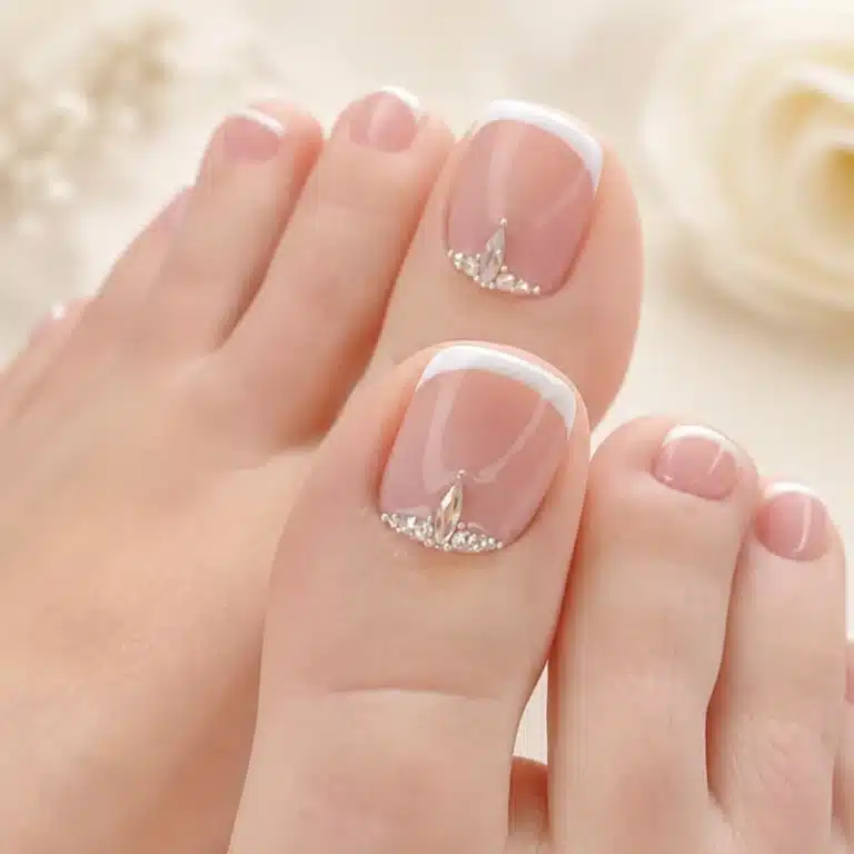 French pedicure with rhinestones and clean white tips