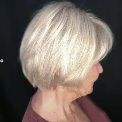 30+ Radiant Short Hairstyles for Women Over 70 With Fine Hair 22 Glowing Champagne Blonde Layered Bob hairstyle