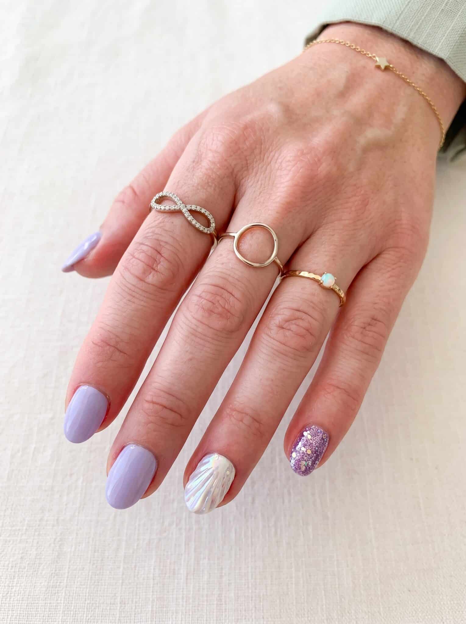 Applying glue to press-on nails to help them last longer