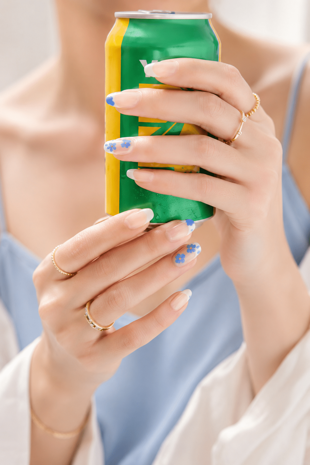 Bright green stick on nails with glossy French tip manicure design