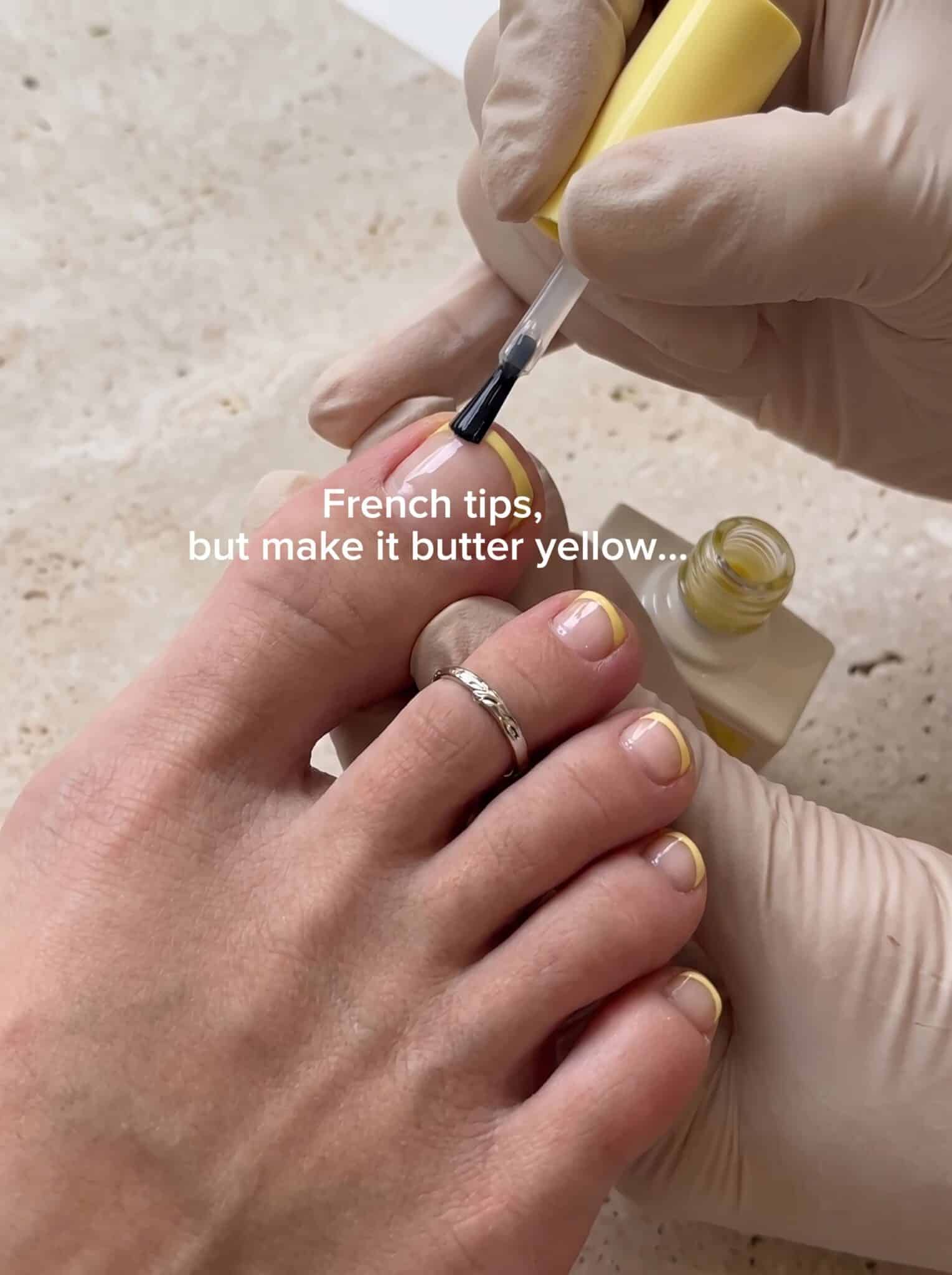 classic french tip toes with glossy white tips and sheer pink pedicure base