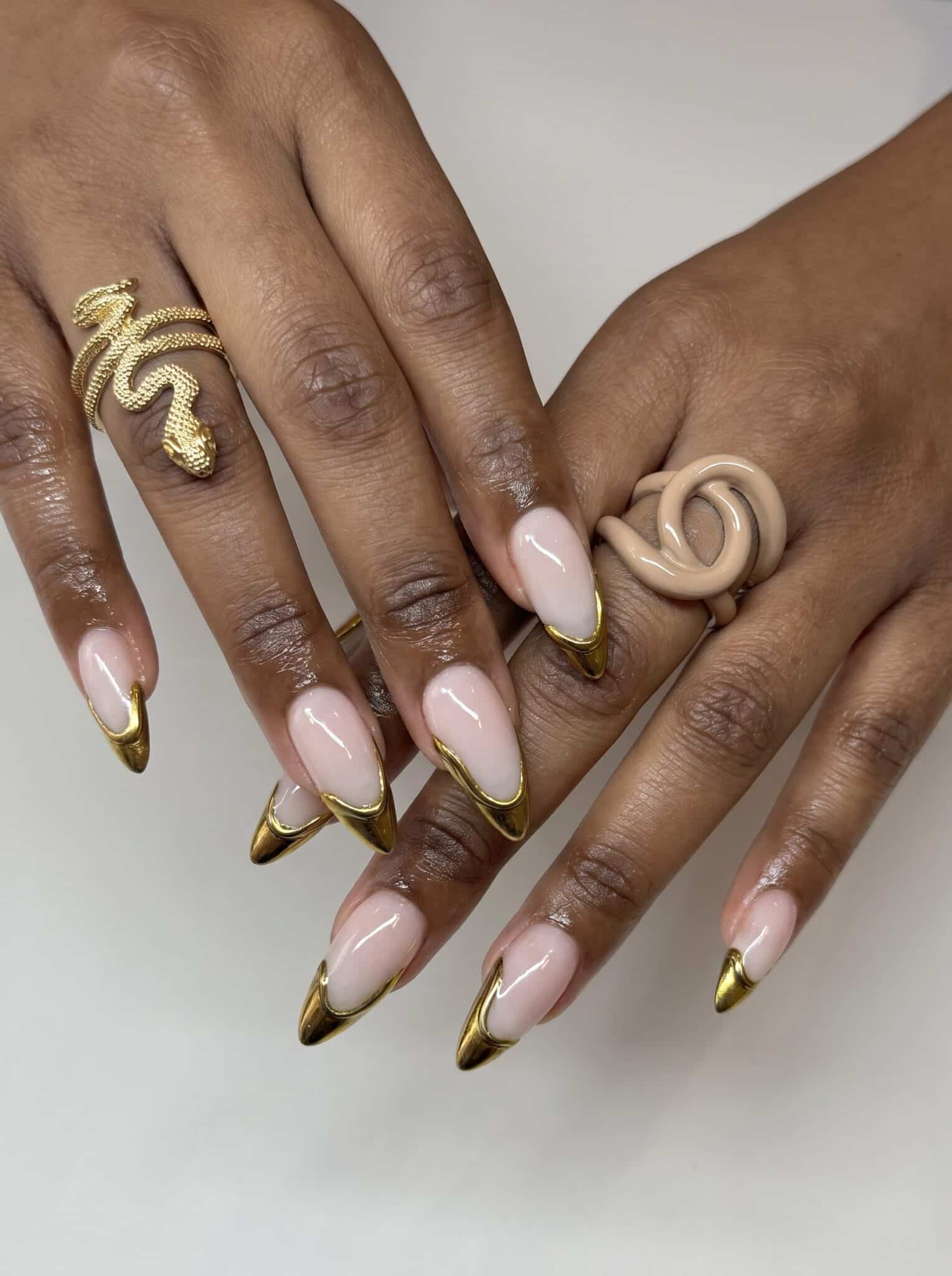 gold chrome french tip nails with milky nude base and summer detail