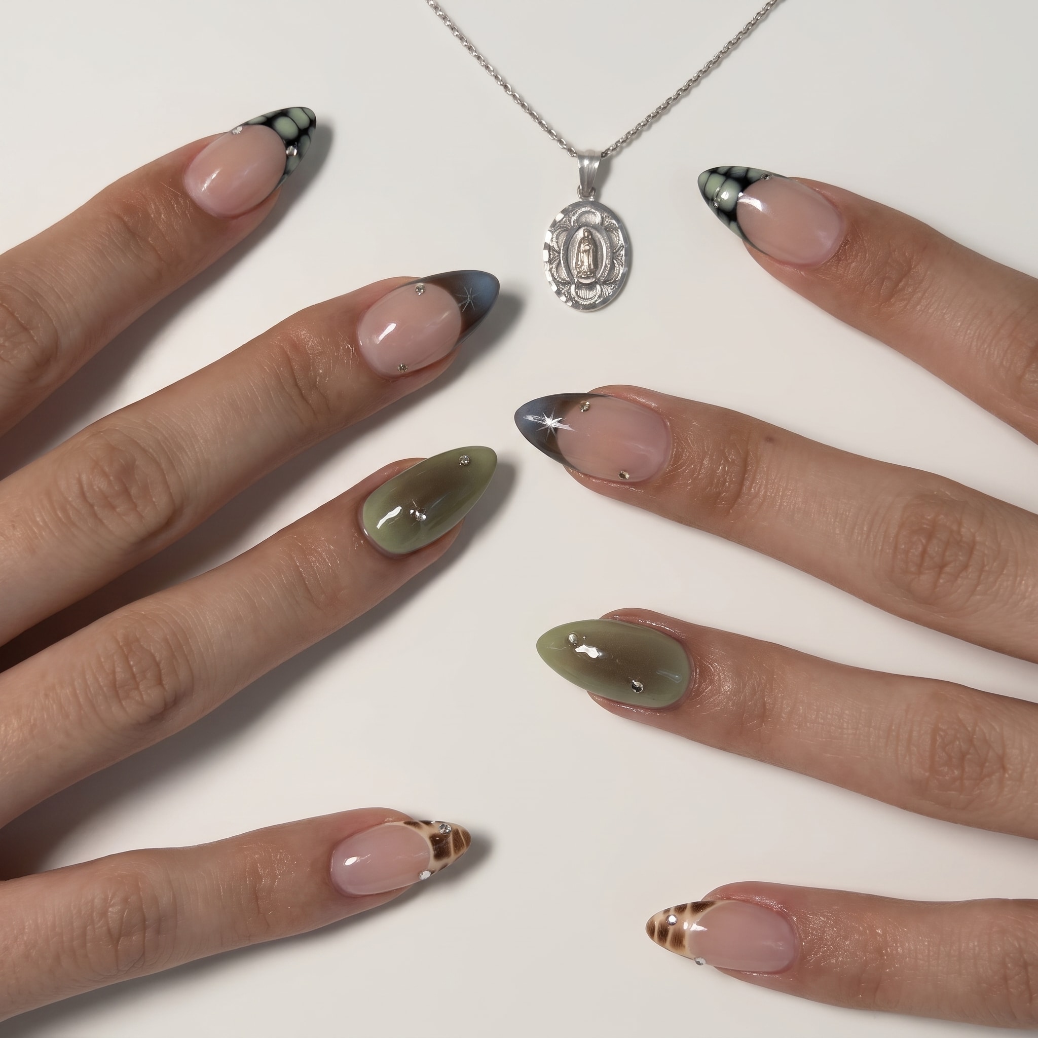 soft green french tip nails with glossy nude base and dreamy summer design