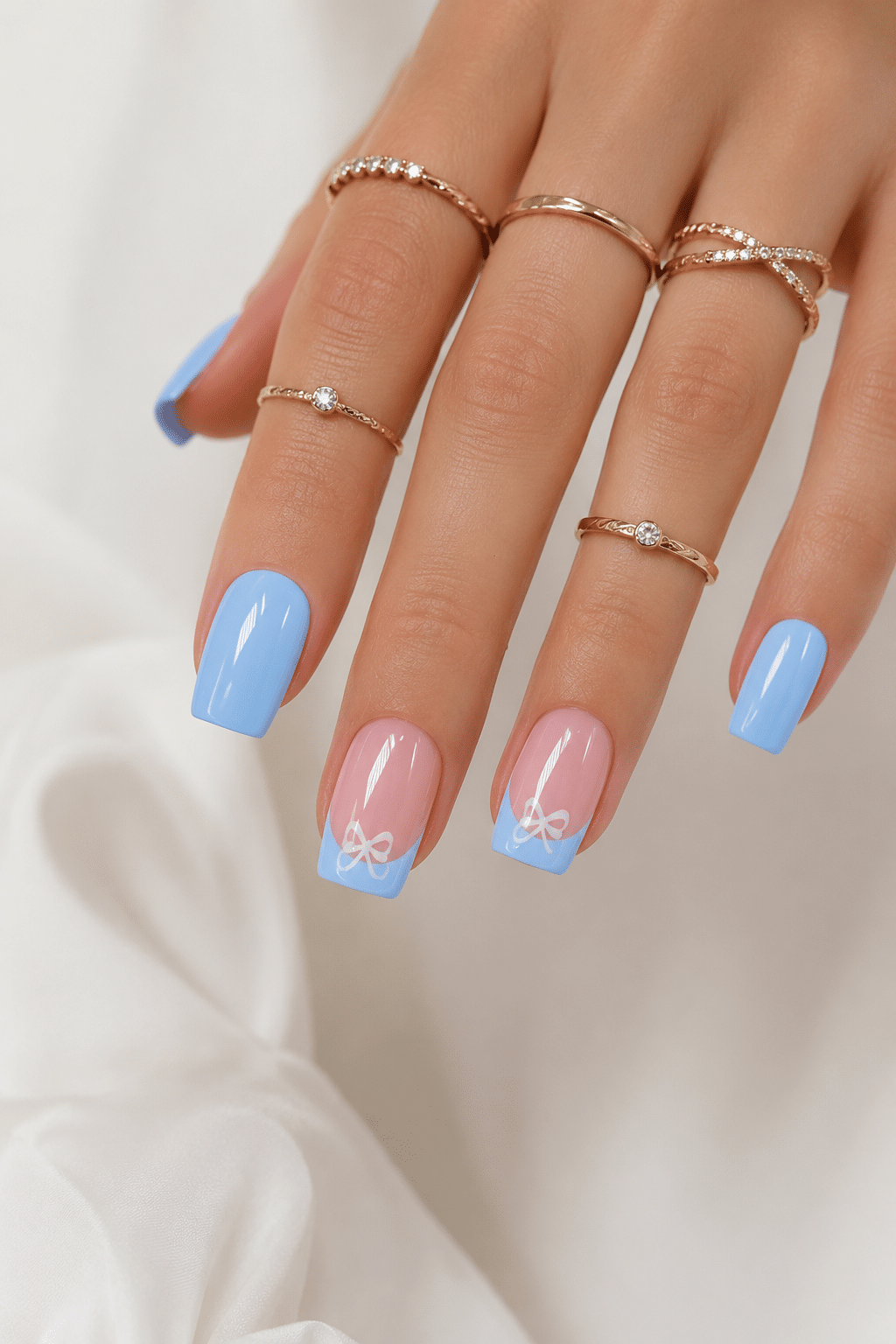 Natural blue French press on nails with a clean baby blue tip