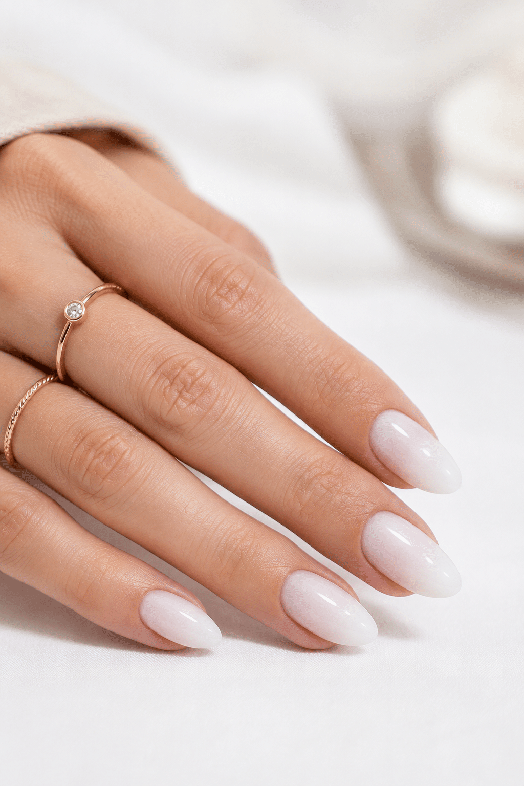 Natural milky white almond press on nails with a clean glossy look