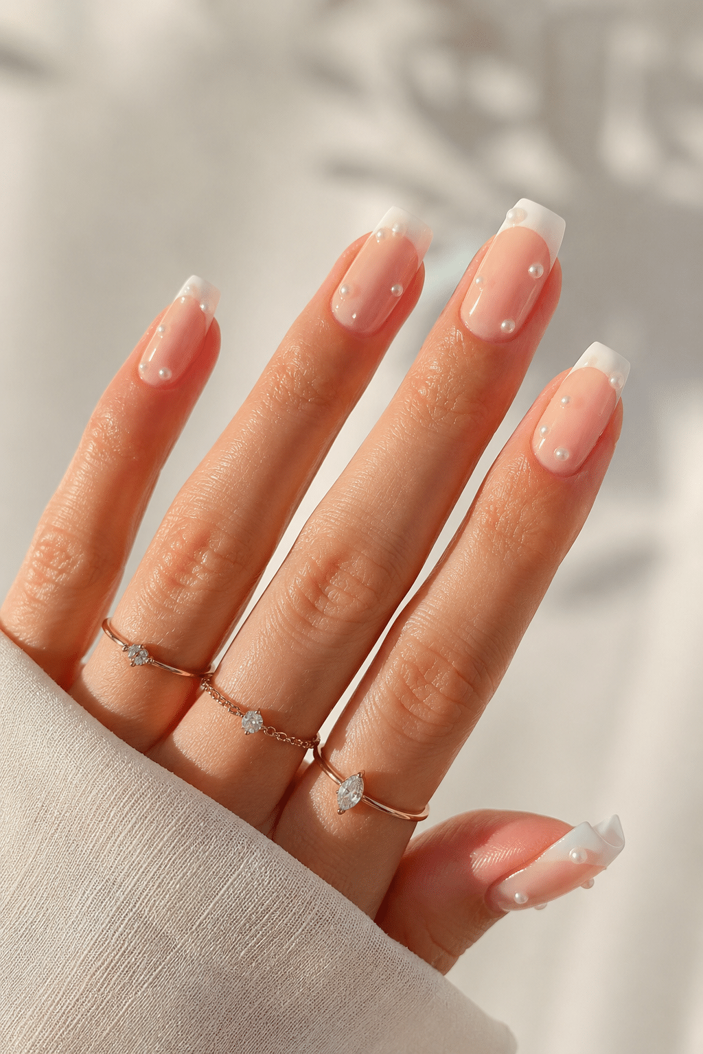 Sheer coral square press on nails with a glossy clean manicure finish