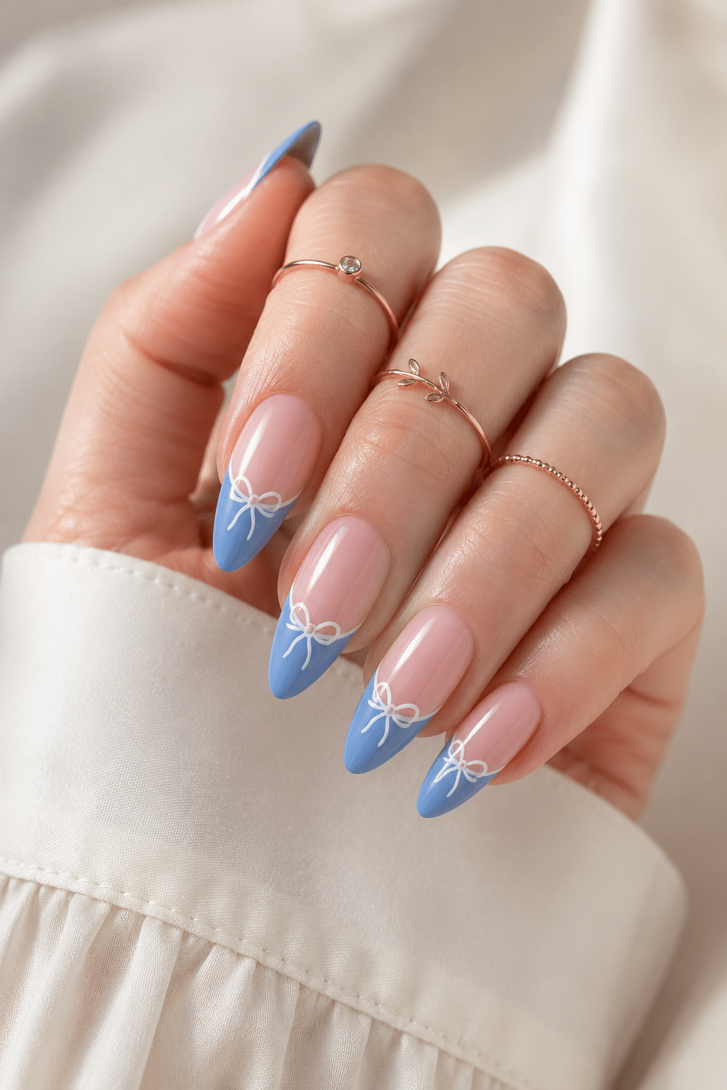 Soft baby blue French bow press on nails with a clean glossy look