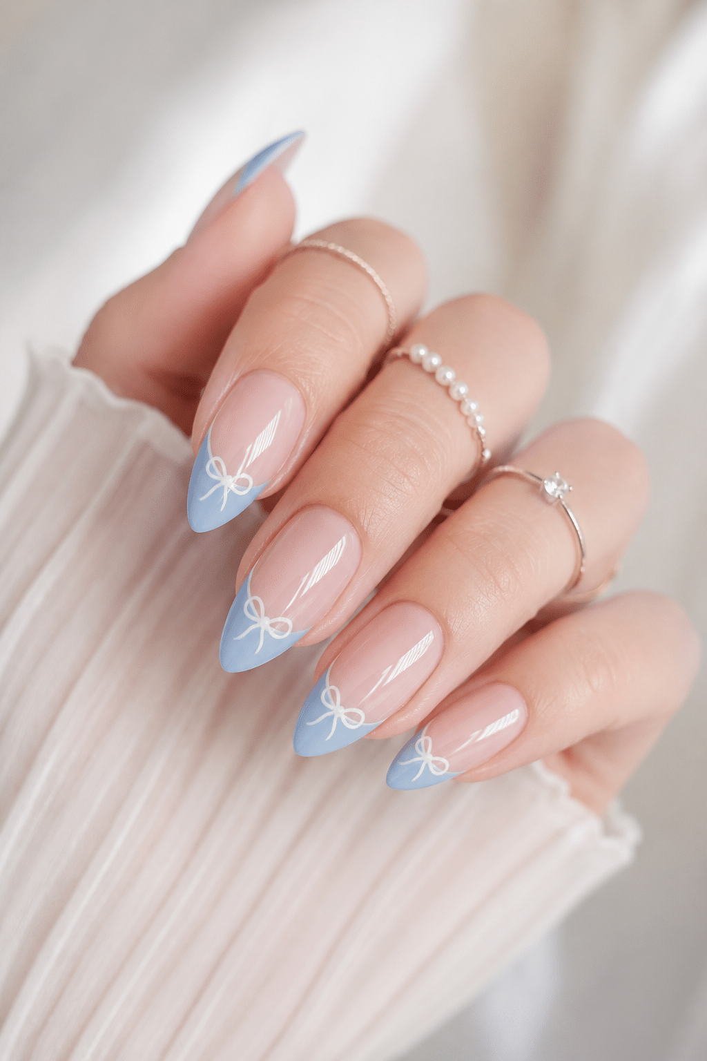 Soft blue ribbon accent press on nails with a glossy natural base