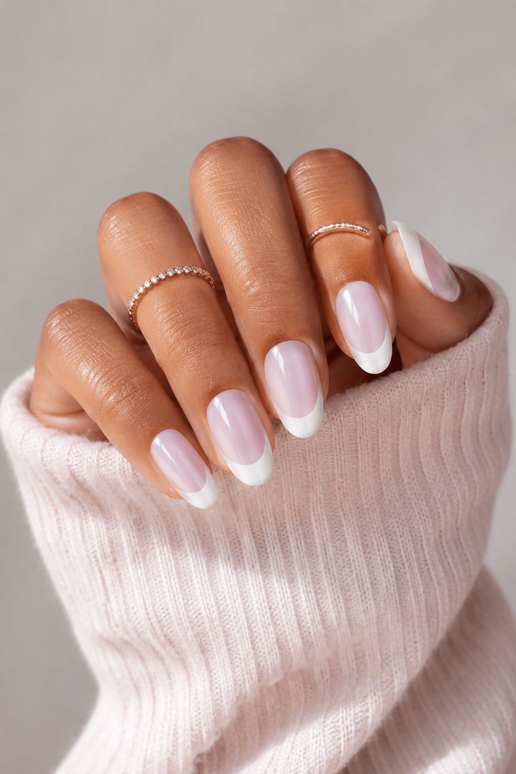 Soft pink oval nails with glossy feminine manicure finish