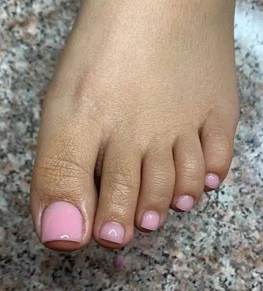 Milky Pink Toes: The Glossy Pedicure That Goes With Everything 2 Soft milky pink toes with a glossy pedicure finish