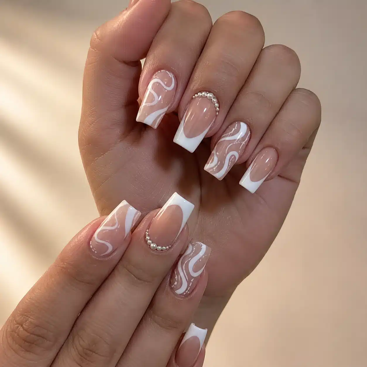 French Tip Nail Tips: Types, Sizing & Application Guide 9 Swirl French tip nail tips on deep skin tone