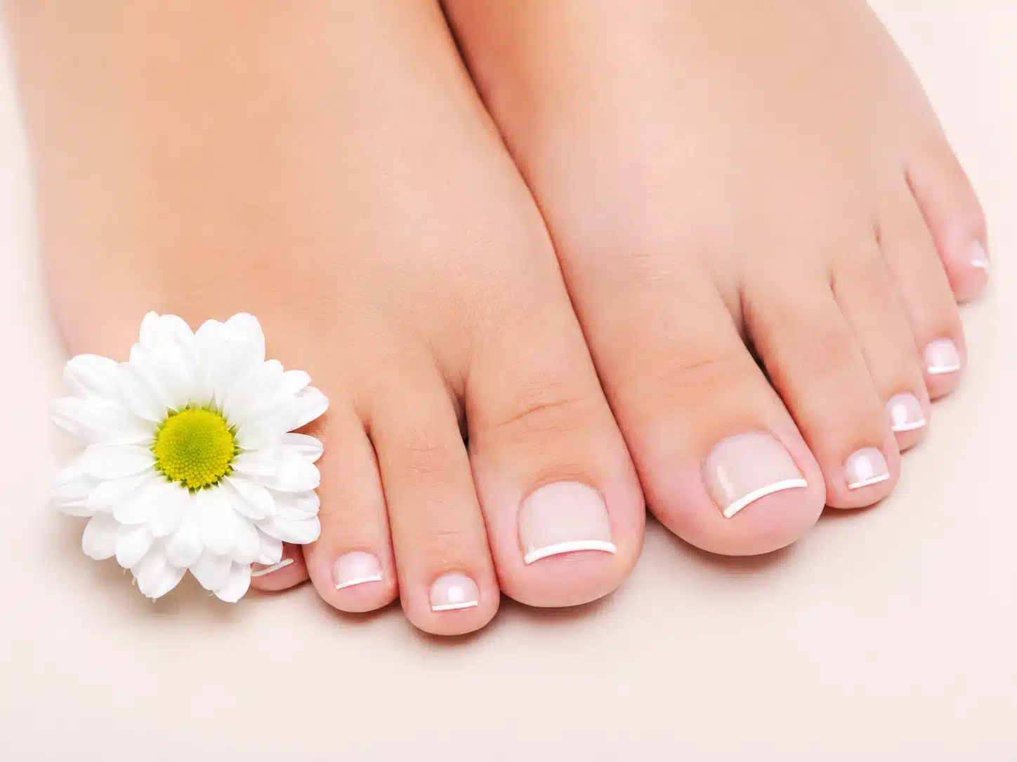 Thin French Tip Toes: Clean Micro French Pedicure Ideas 3 Thin French tip toes with a small flower accent