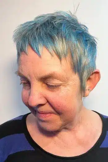 Choppy Silver Pixie With Blue Accents haircut for women over 60