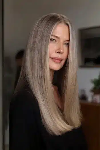 A polished straight blunt cut for fine hair, included in 30 inspiring long hairstyles for women over 50 with fine hair.